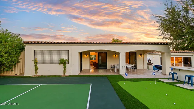 a view of a house with swimming pool and porch