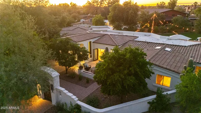 a view of a patio with couches under an umbrella