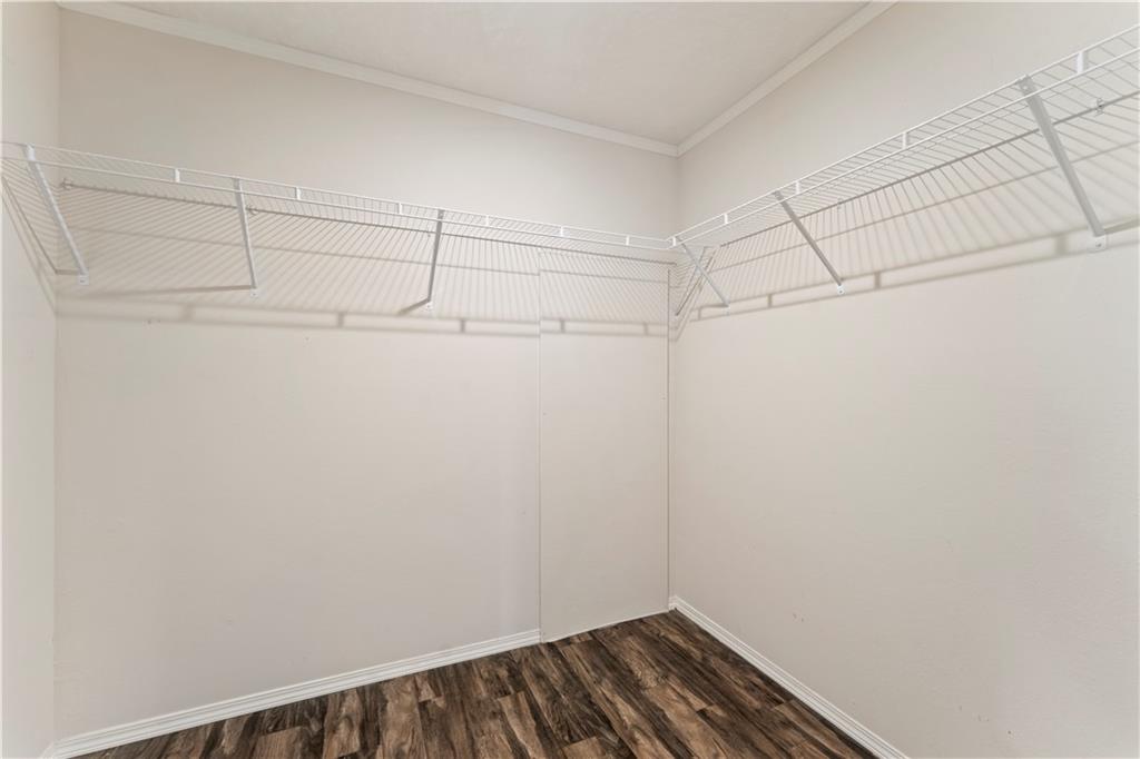 89 Ridge Road Seale, AL 36875 - Photo 26 of 46 Corner closet with wire shelving and wood-finish flooring