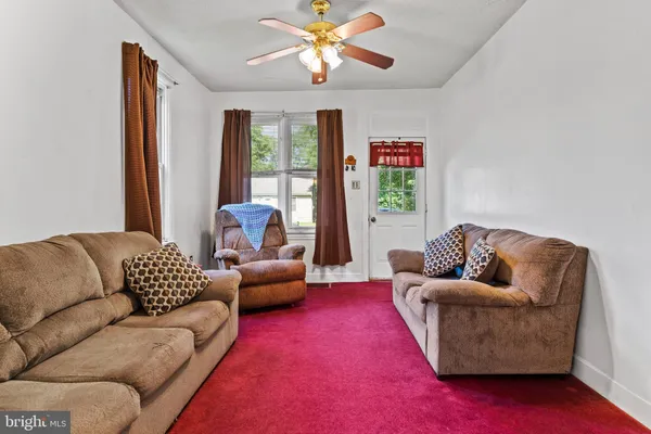 a living room with furniture and a couch