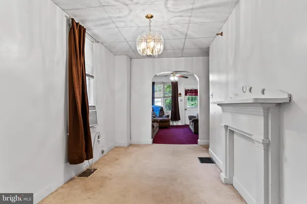 a view of a hallway with washer and dryer
