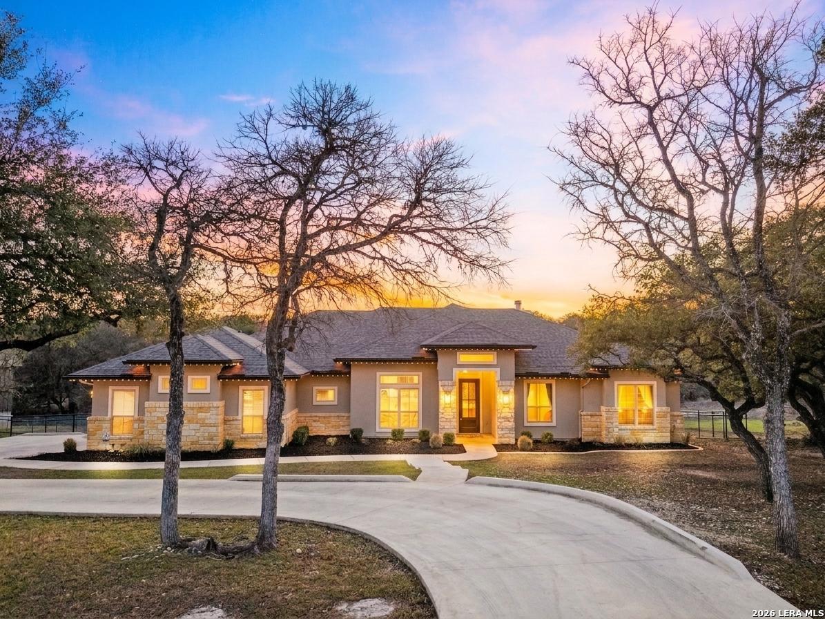 431 Hidden Springs Spring Branch, TX 78070 - Photo 1 of 1 a front view of a house with a yard and potted plants