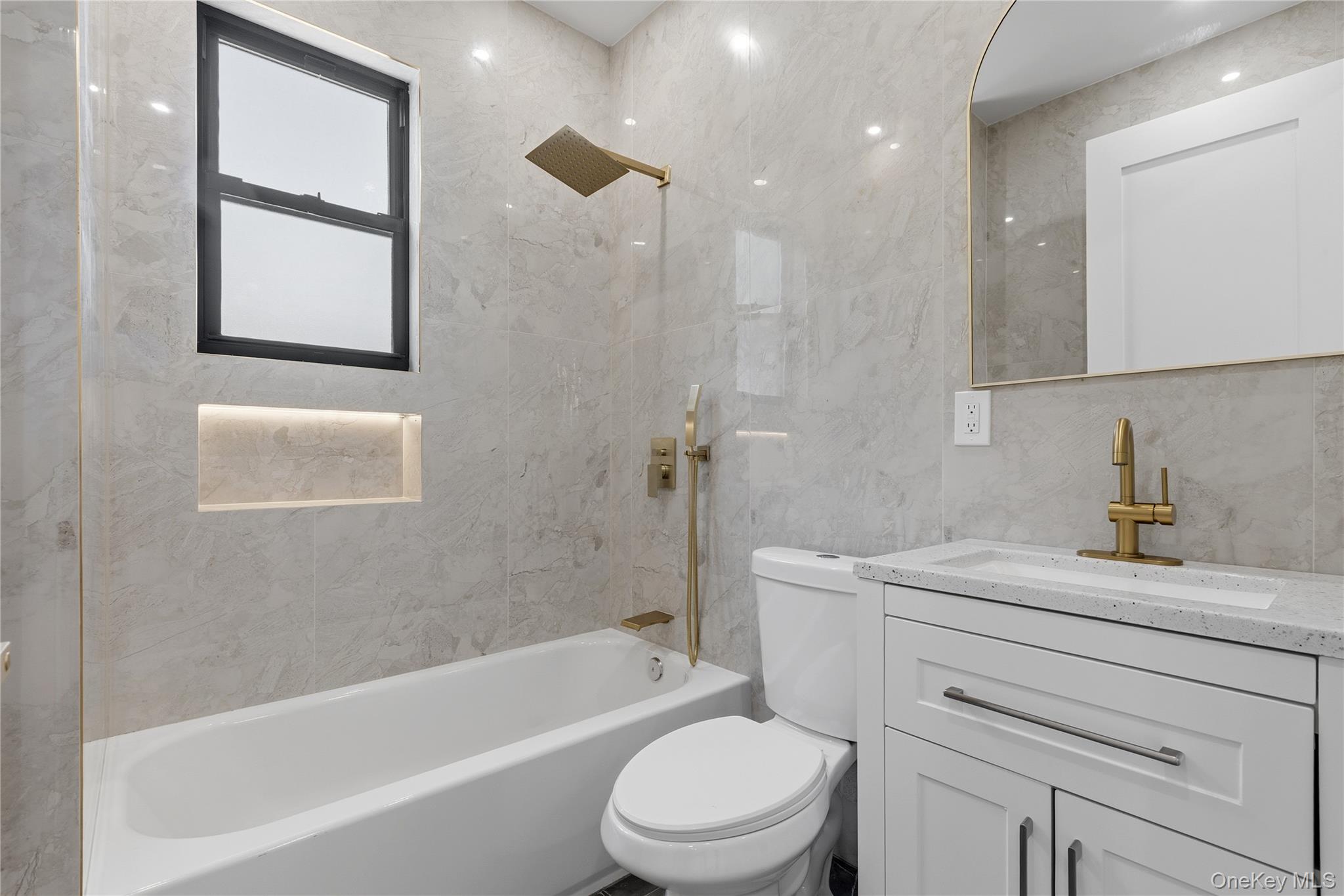 548 Lakes Road Monroe, NY 10950 - Photo 31 of 50 a bathroom with a sink a toilet and a bathtub