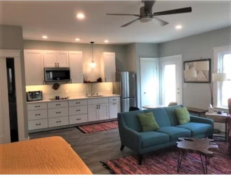 1433 Acadia Street, Unit DOWN Durham, NC 27701 - Photo 2 of 7 a living room with furniture a couch and kitchen view