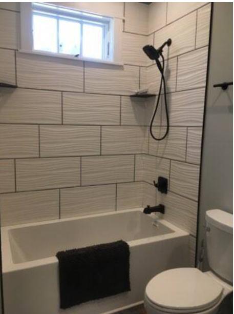 1433 Acadia Street, Unit DOWN Durham, NC 27701 - Photo 4 of 7 a bathroom with a toilet a sink and bathtub