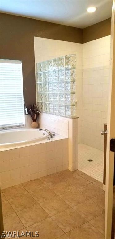 2983 Point Street North Port, FL 34286 - Photo 12 of 19 a bathroom with a bathtub and shower