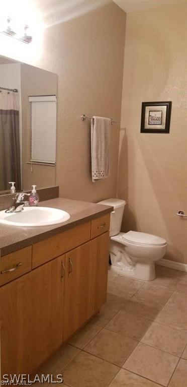 2983 Point Street North Port, FL 34286 - Photo 13 of 19 a bathroom with a sink a toilet and mirror