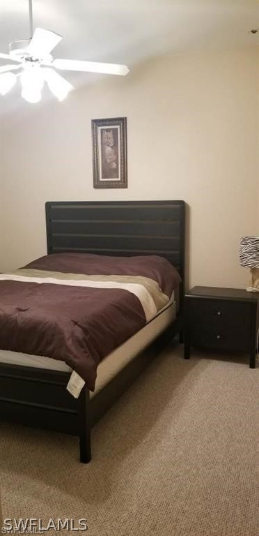 2983 Point Street North Port, FL 34286 - Photo 15 of 19 a bedroom with a bed and a lamp