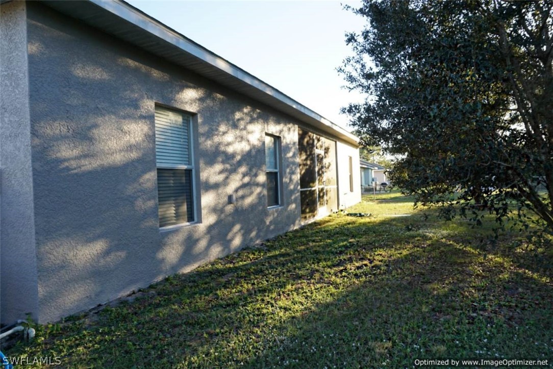 2983 Point Street North Port, FL 34286 - Photo 17 of 19 a view of back yard of the house