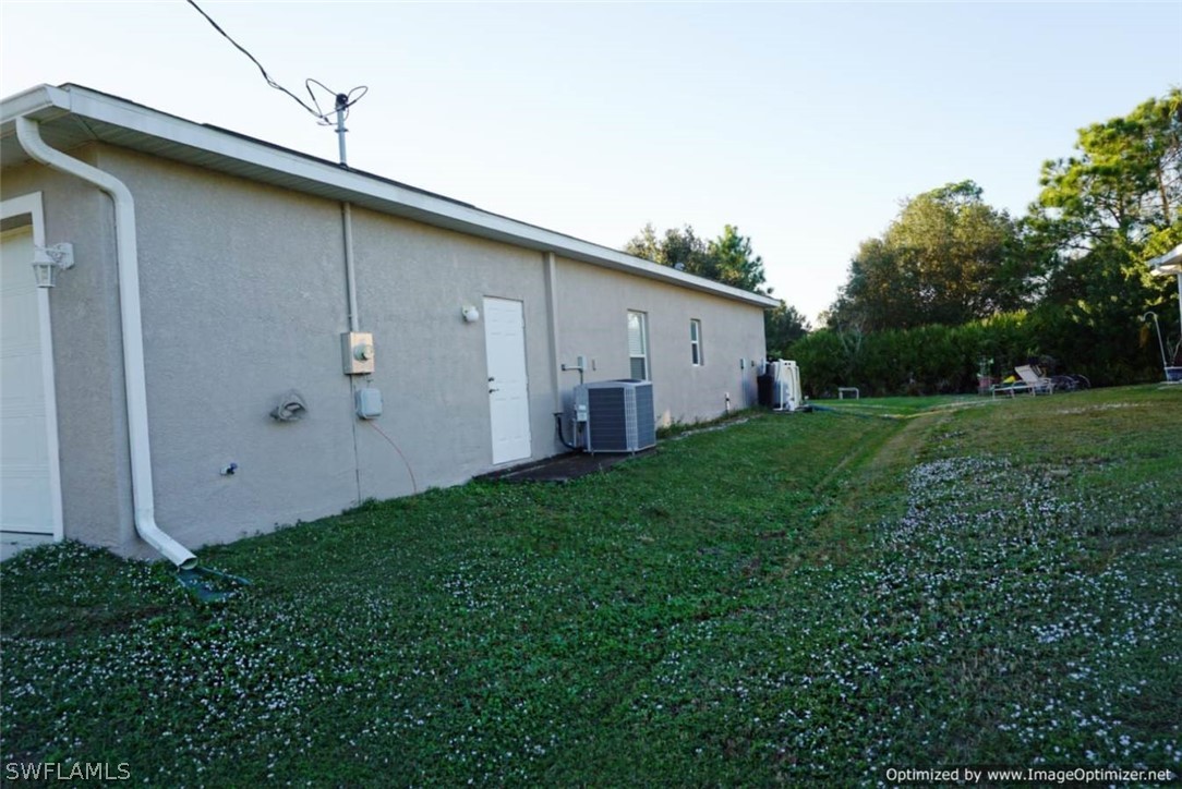 2983 Point Street North Port, FL 34286 - Photo 18 of 19 a backyard of a house with lots of green space