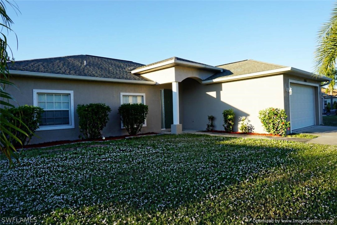 2983 Point Street North Port, FL 34286 - Photo 2 of 19 a view of a house with a small yard and a large window