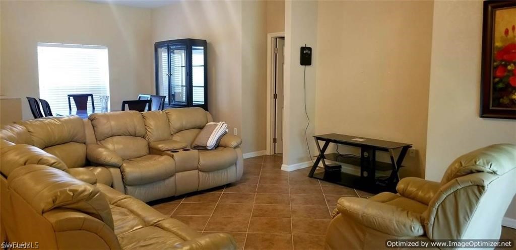 2983 Point Street North Port, FL 34286 - Photo 4 of 19 a living room with furniture and a fireplace