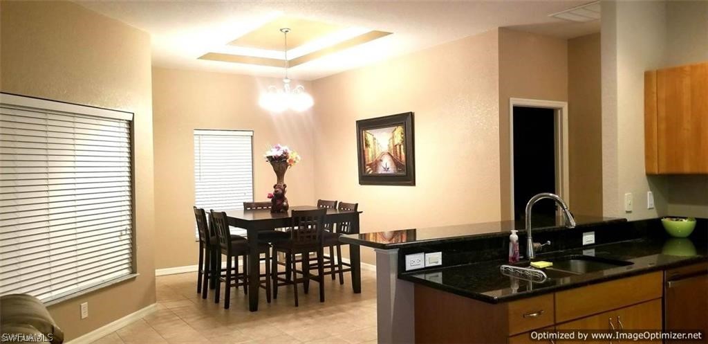 2983 Point Street North Port, FL 34286 - Photo 7 of 19 a dining room with furniture and window