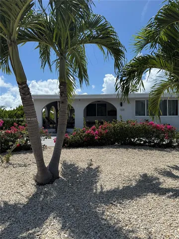 a lobby with furniture and floor to ceiling window