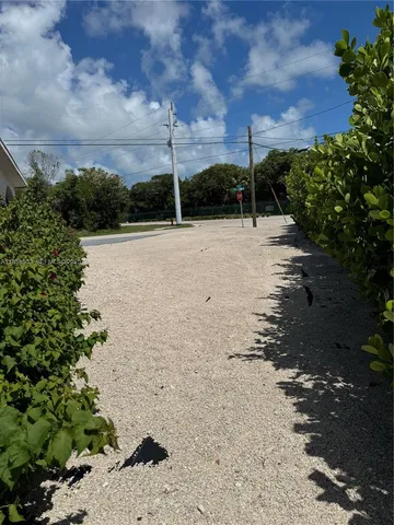 a bathroom with a sink toilet and mirror