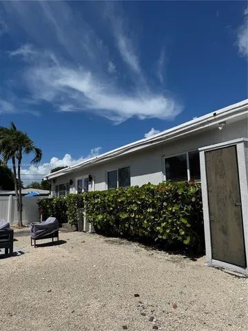 a bathroom with a sink toilet and mirror