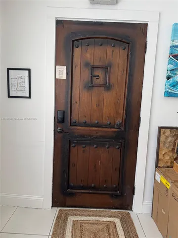 a bedroom with a bed and a television