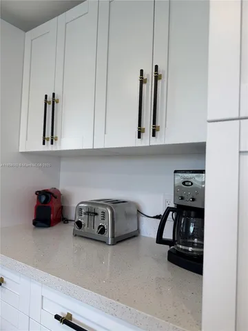 a view of a table and chairs in front of a house