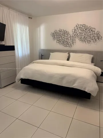 a view of a lake with couches in patio