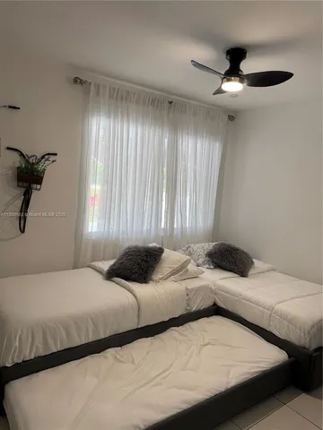 a bathroom with a toilet a sink and shower