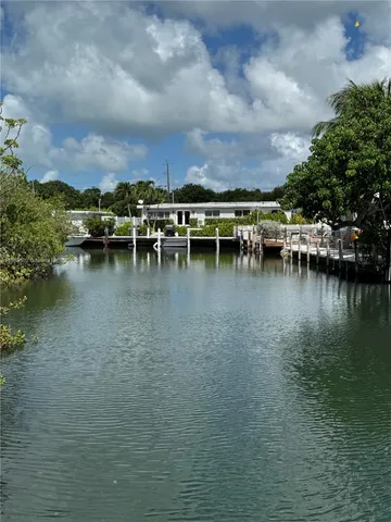 a bathroom with a granite countertop toilet sink and shower