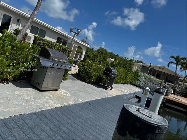 a living room with furniture and a chair