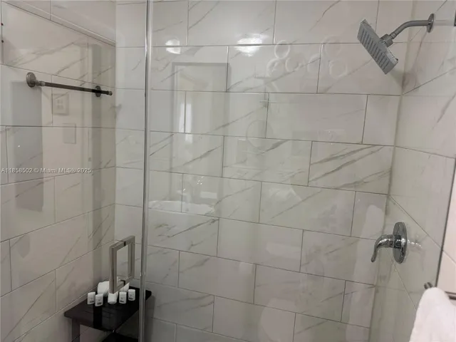 a bedroom with bed and window