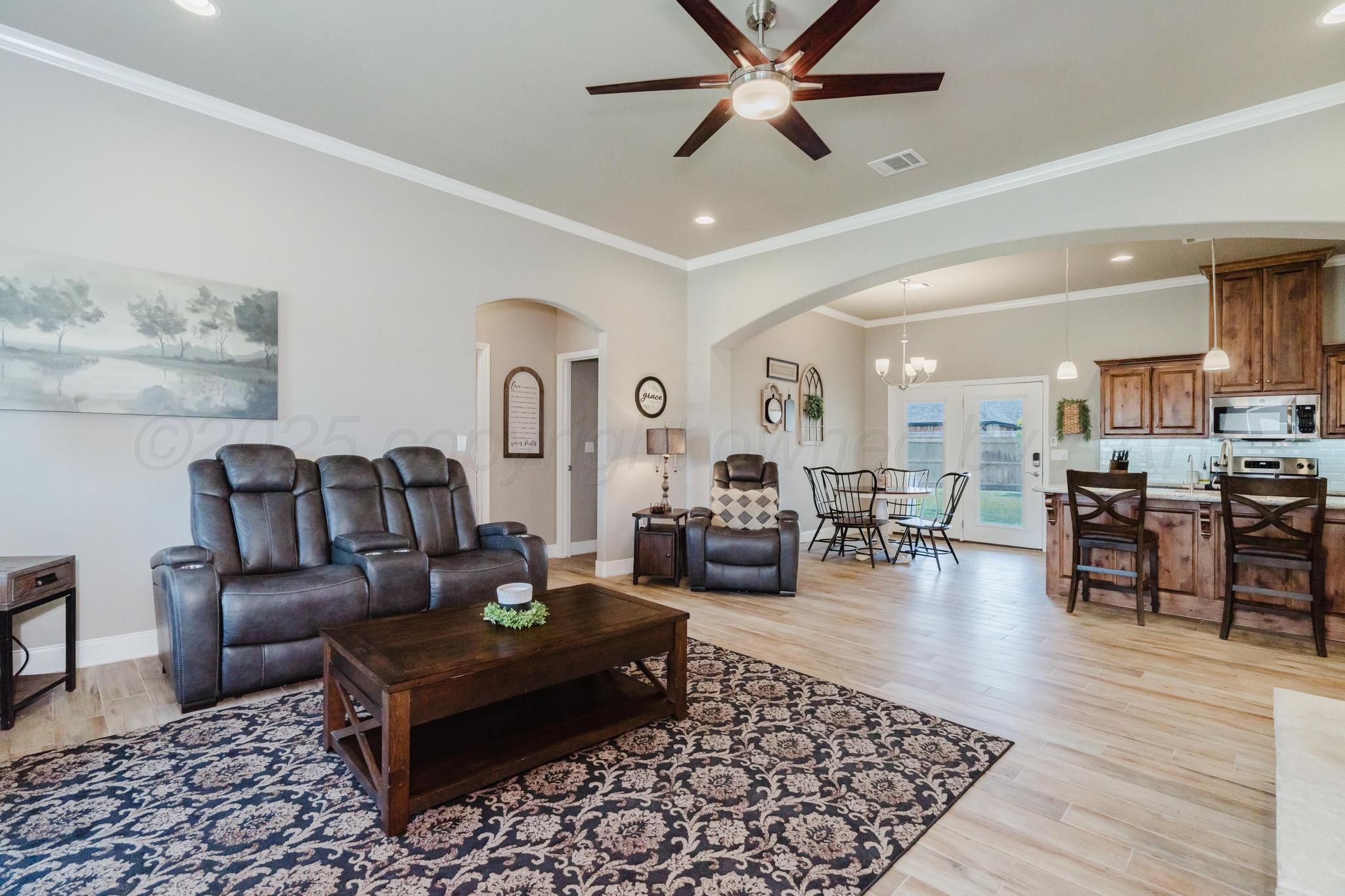 9011 Staten Island Amarillo, TX 79119 - Photo 2 of 17 a living room with furniture and wooden floor