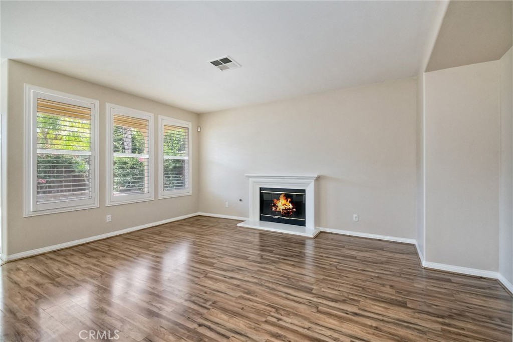 28961 Savannah Drive Temecula, CA 92591 - Photo 14 of 54 a view of an empty room with a window and wooden floor