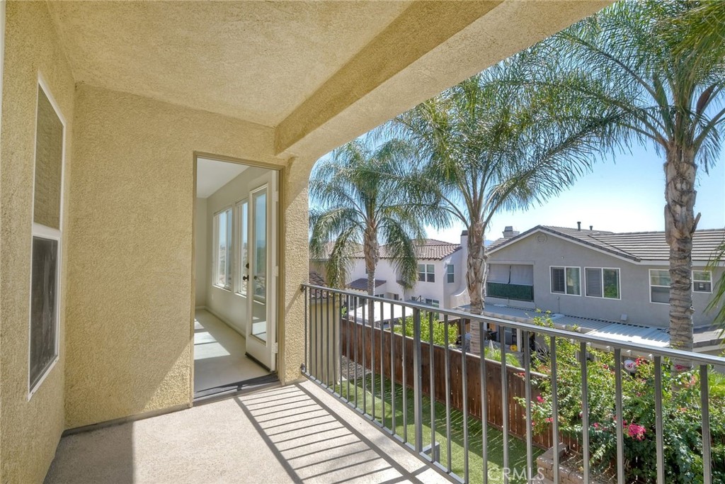 28961 Savannah Drive Temecula, CA 92591 - Photo 27 of 54 a front view of a house with a garden and yard