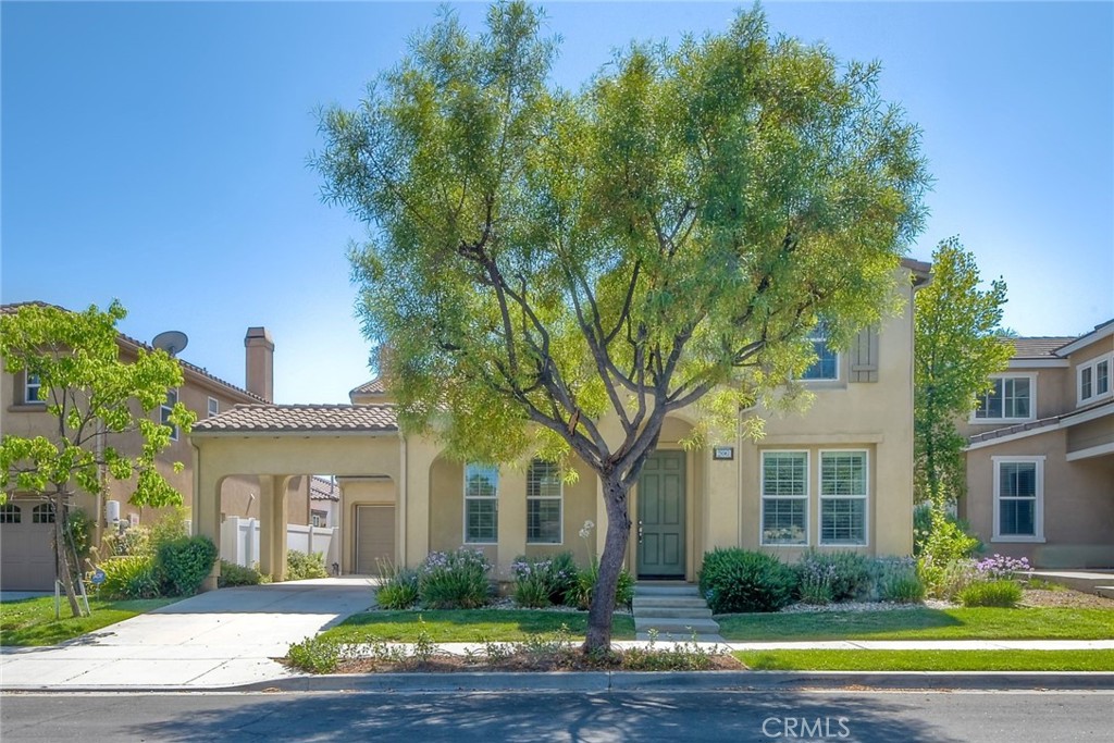 28961 Savannah Drive Temecula, CA 92591 - Photo 3 of 54 a front view of a house with garden