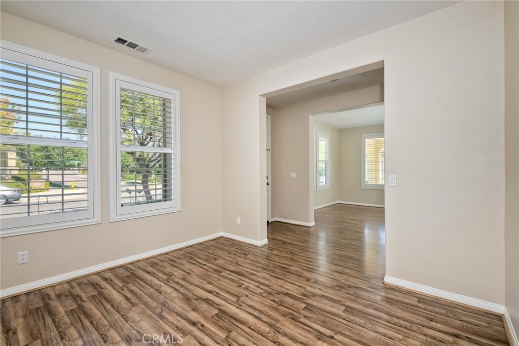 28961 Savannah Drive Temecula, CA 92591 - Photo 6 of 54 a view of an empty room with wooden floor and a window