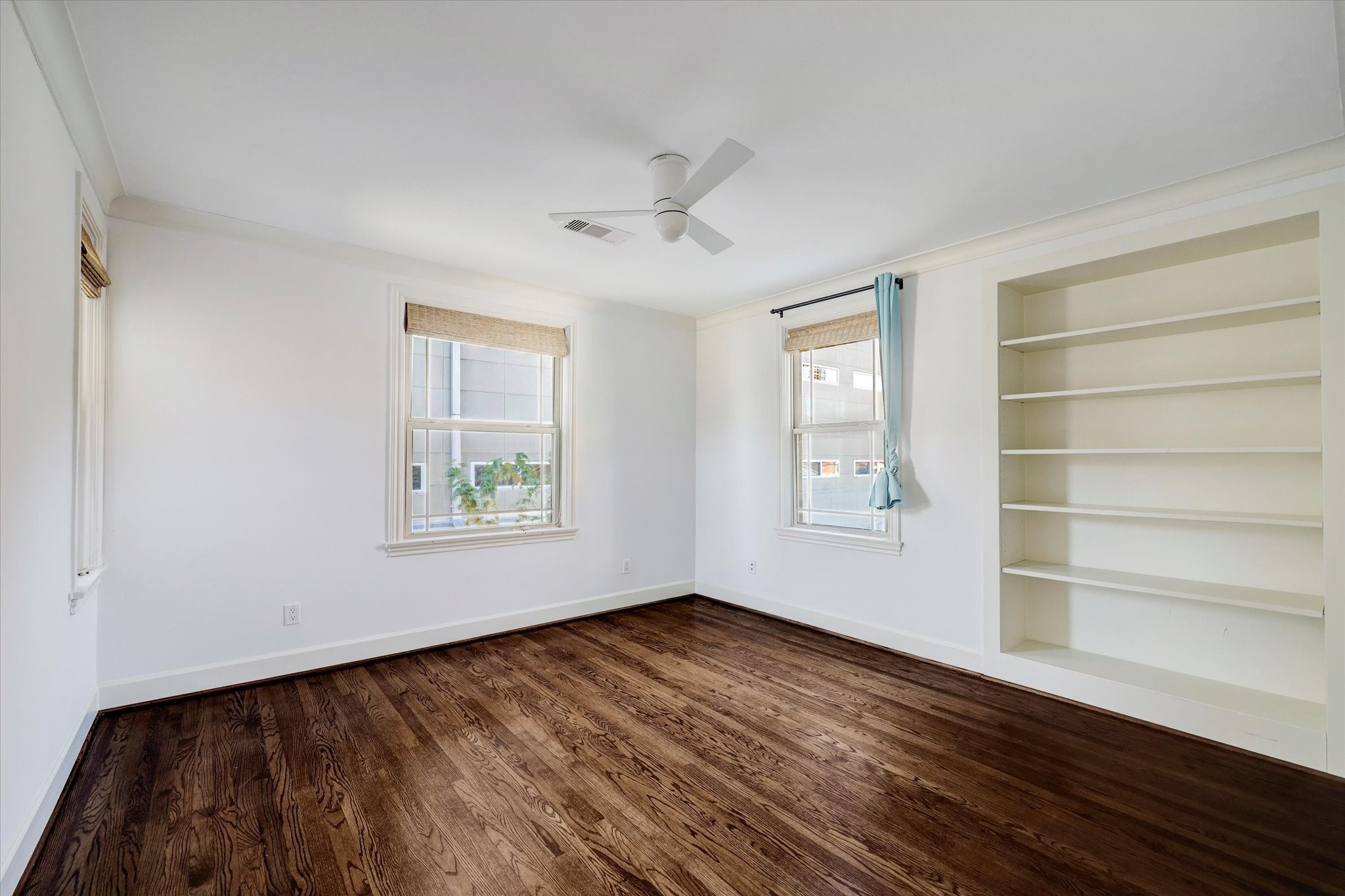2622 Westgate Drive Houston, TX 77098 - Photo 14 of 20 a view of an empty room with a window and wooden floor