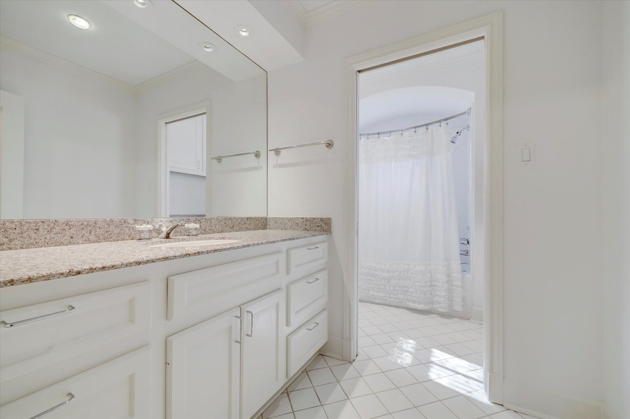 2622 Westgate Drive Houston, TX 77098 - Photo 15 of 20 a bathroom with a granite countertop sink and a mirror