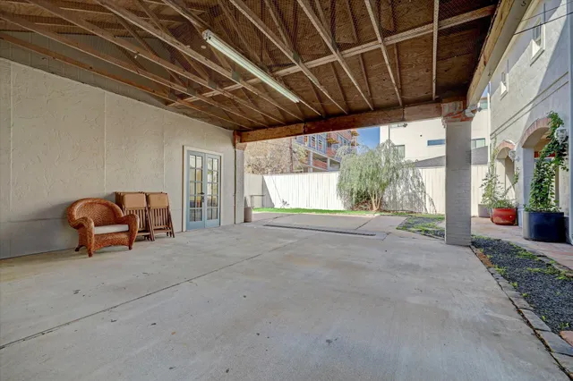 a view of a room with furniture and windows