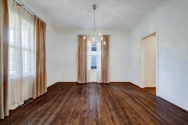 a view of a room with wooden floor staircase and a living room