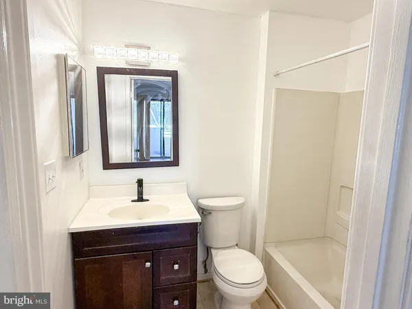 a view of a bathroom from a hallway