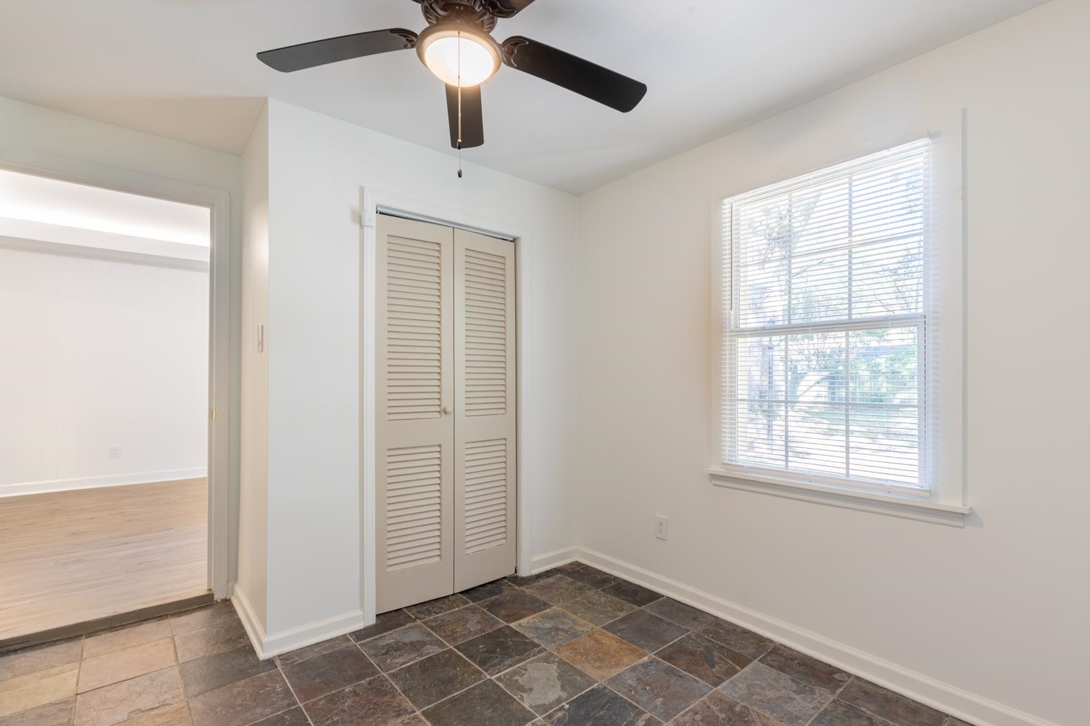 4704 Kaye Road Memphis, TN 38117 - Photo 16 of 28 an empty room with windows and fan