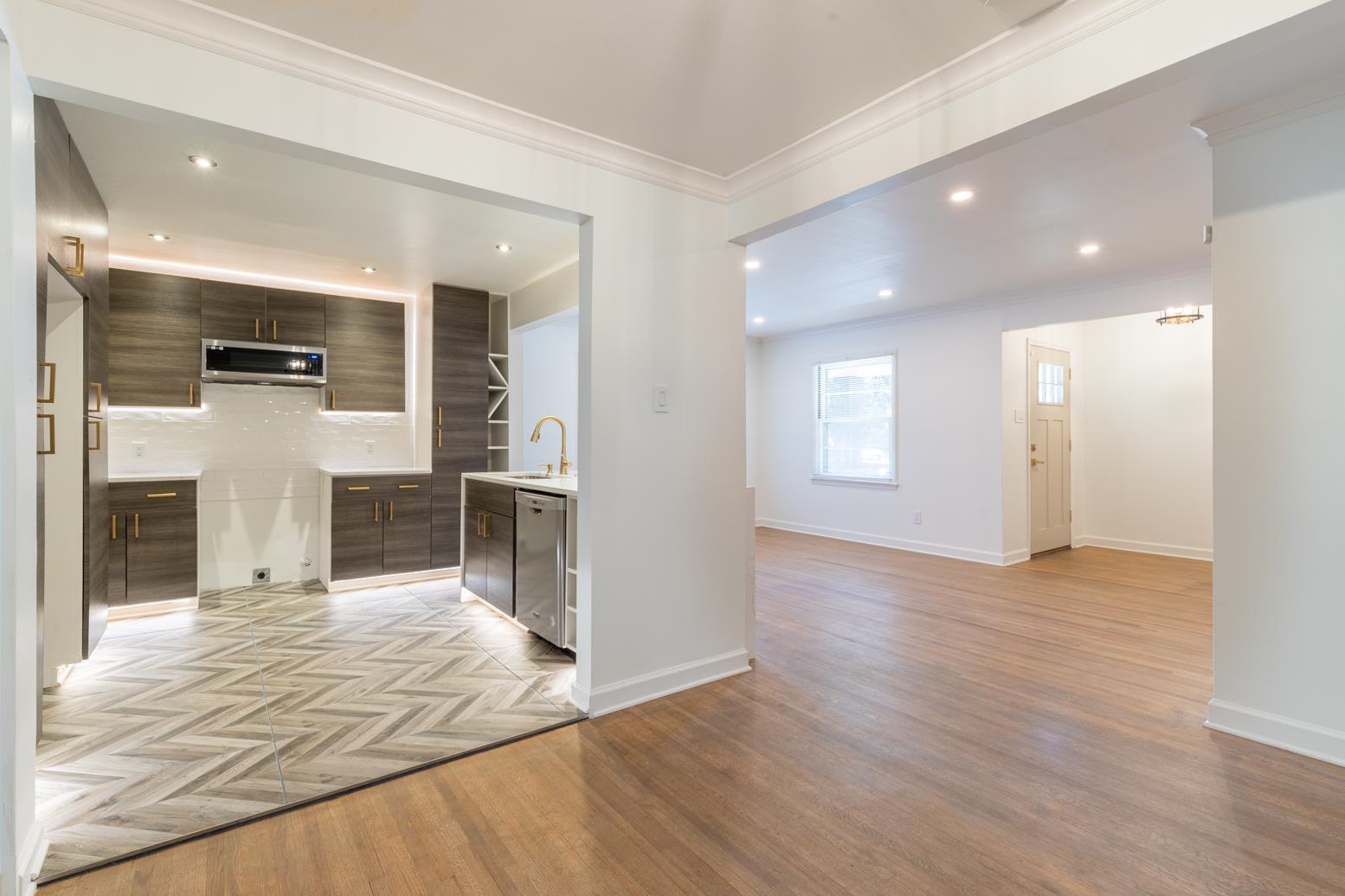 4704 Kaye Road Memphis, TN 38117 - Photo 9 of 28 a view of a hallway with wooden floor and a kitchen