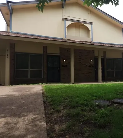 a house view with a garden space