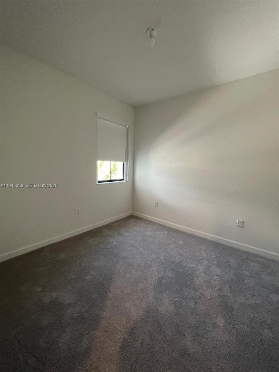 12908 Southwest 233rd Terrace Homestead, FL 33032 - Photo 15 of 23 a view of empty room with window