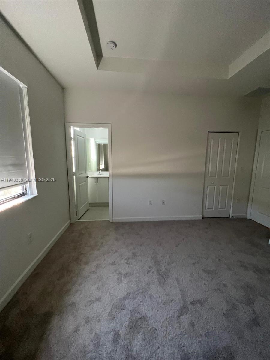 12908 Southwest 233rd Terrace Homestead, FL 33032 - Photo 19 of 23 an empty room with windows