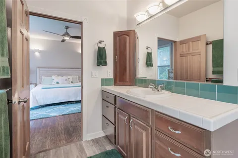 a bathroom with a sink and a mirror