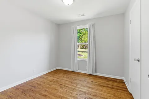 a view of an empty room and window