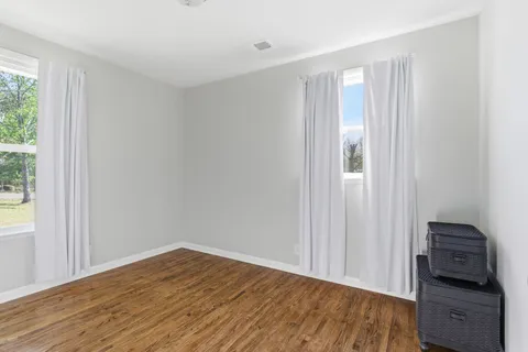 a view of a livingroom with wooden floor