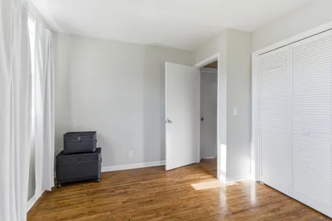 a view of a livingroom with wooden floor