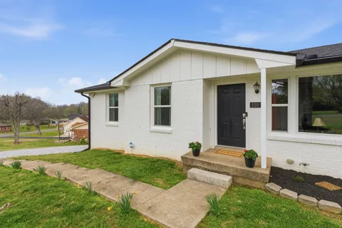 a front view of a house with garden