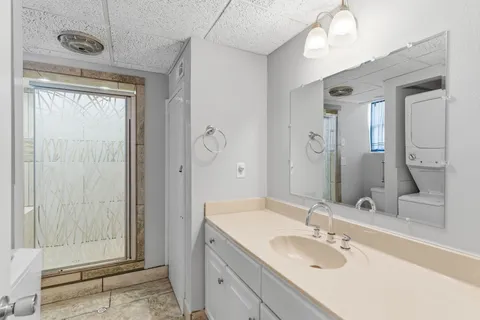 a bathroom with a sink double vanity and a mirror