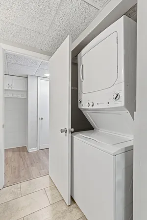 a view of bathroom with a washer and dryer