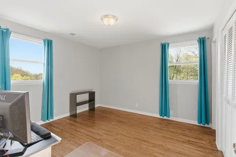 a view of a room that has a window in it